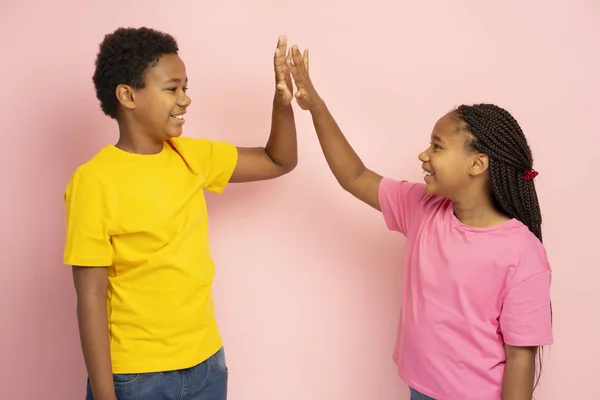 Smiling African American Kids Wearing Colorful Shirts Giving High Five — Stock Photo, Image