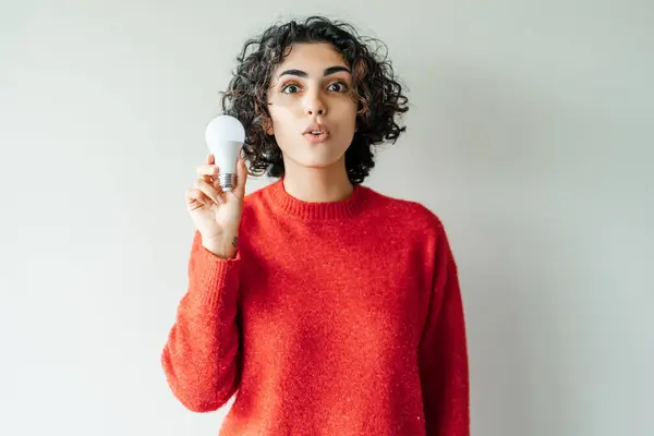 Surprised Middle Eastern Woman Holding Light Bulb Feeling Inspired Happy — Stock Photo, Image