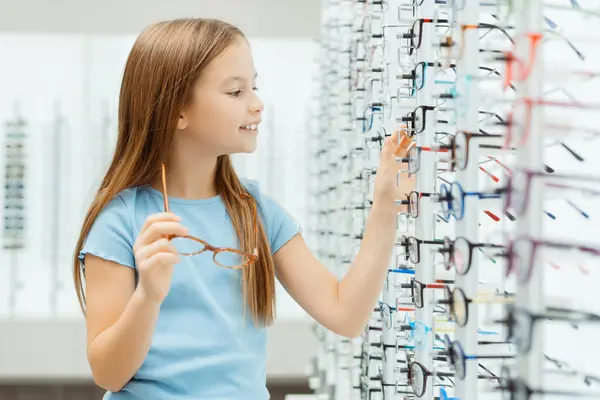 Smiling Little Girl Looking Lot Glasses Shop Health Care Concept — Stock Photo, Image