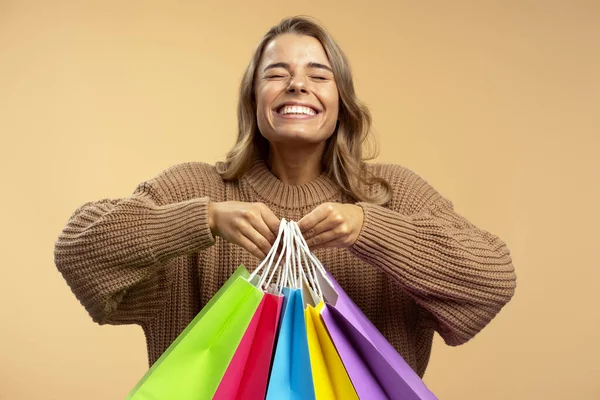 Young Overjoyed Woman Holding Many Colorful Shopping Bags Isolated Beige — Stock Photo, Image