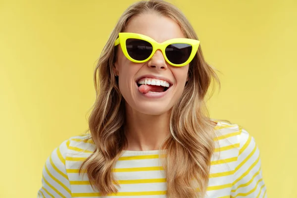 Portrait Beautiful Smiling Woman Wearing Stylish Yellow Sunglasses Showing Tongue — Stock Photo, Image