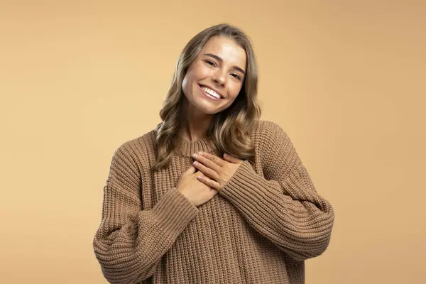 Attractive Smiling Woman Wearing Brown Goat Sweater Holding Hands Heart — Stock Photo, Image