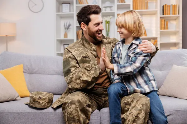 Tender Moment Unfolds Home Son Sits His Father Knees Hands — Stock Photo, Image