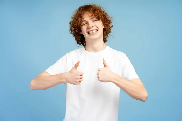 Handsome Smiling Boy Braces Showing Thumbs Gesture Isolated Blue Background — Stock Photo, Image