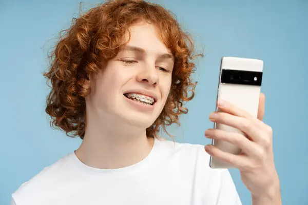 Portrait Cheerful Curly Red Headed Teenager Male Braces Focusing His — Stock Photo, Image