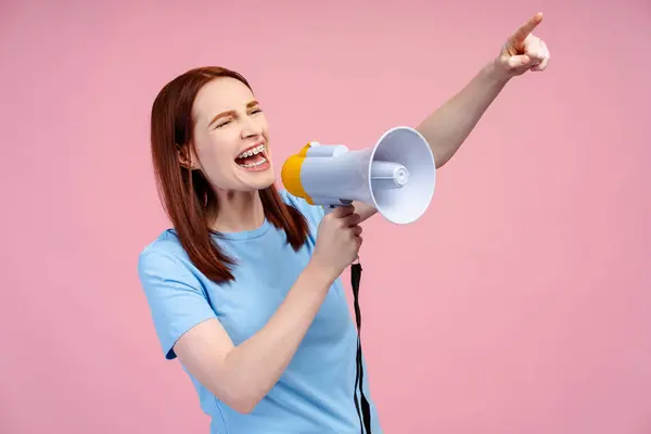 Red Haired Woman Wearing Brackets Energetically Shouting Loudspeaker Making Pointing — Stock Photo, Image