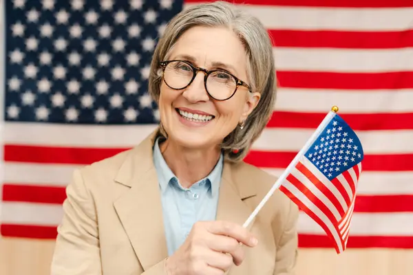Portrait Smiling Confident Senior Woman Politician Holding American Flag Looking — Stock Photo, Image