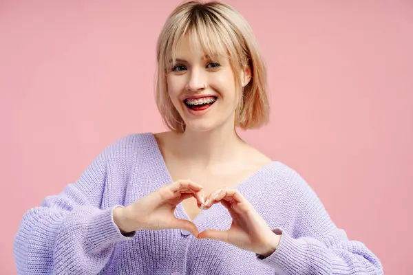 Smiling Young Woman Braces Showing Heart Shape Looking Camera Gesturing — Stock Photo, Image