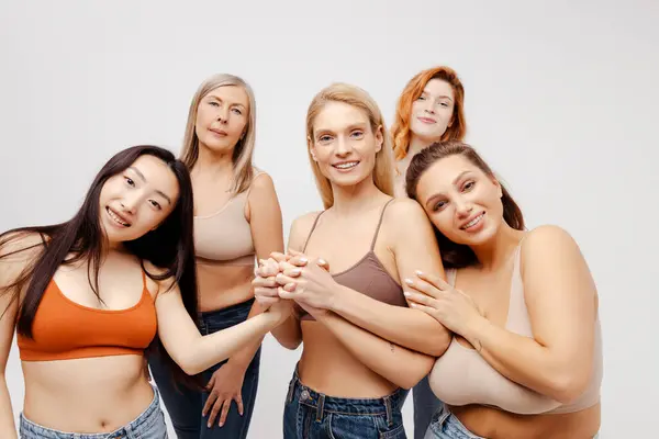 Group Diverse Women Wearing Bras Jeans Hugging Looking Camera Attractive — Stock Photo, Image