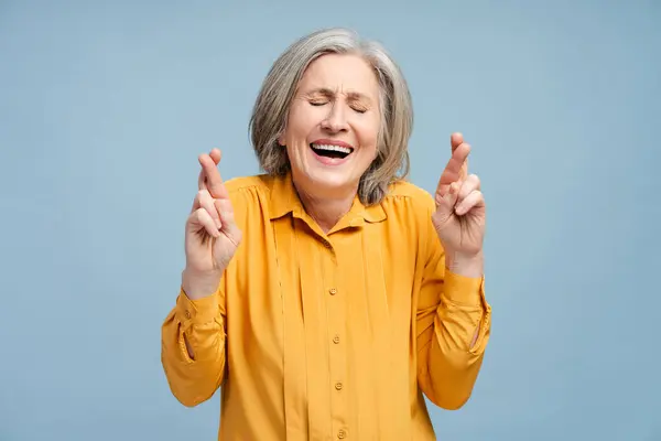 Smiling Senior Woman Wearing Casual Shirt Crossed Fingers Standing Isolated — Stock Photo, Image