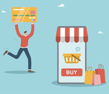 Paying with a credit card in online stores, buying a product on an e-commerce website, a man buys goods on the Internet with a credit card, makes payment using online banking and mobile phone.