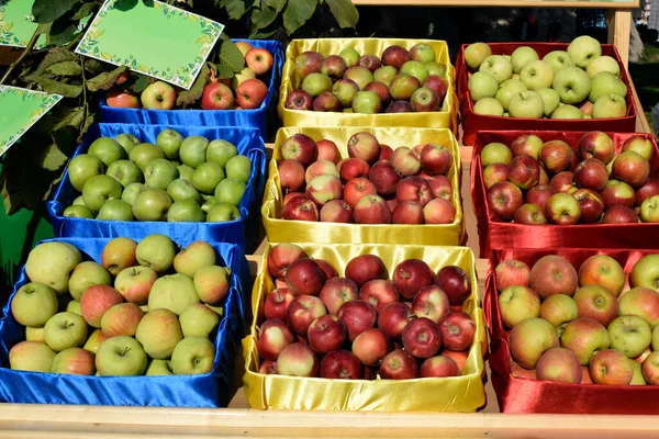 Crates of fresh apples for sale at the farmers market