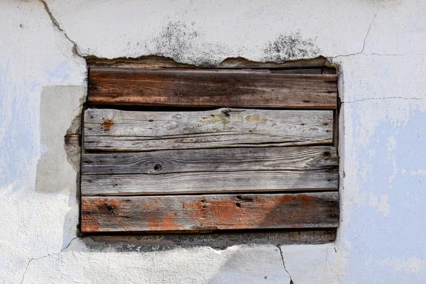 stock image Boarded window background on an old white wall, frame, graphic resource