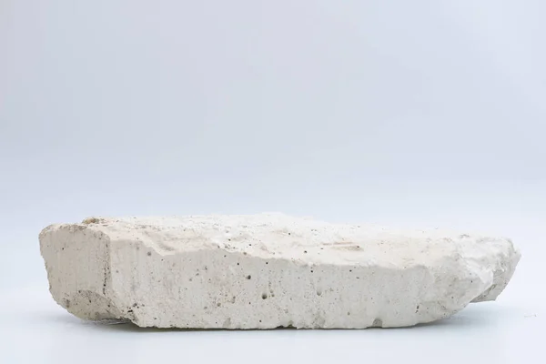 白色背景的白色石头 产品的讲台 图库照片