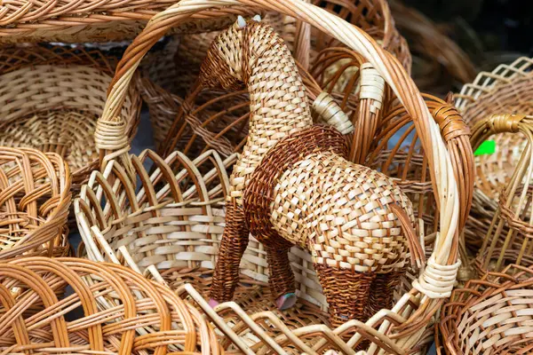 stock image Handmade wicker horse and baskets, rustic decor items