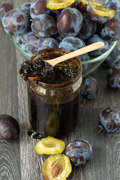 stock image Jar of plum jam, fresh plums for preservation