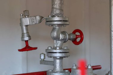 Red valves on a silver pipe clipart