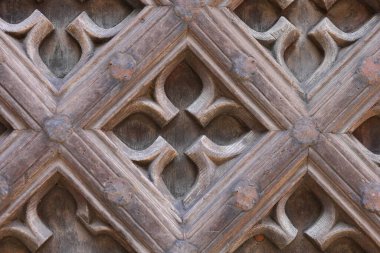 Wooden ornament on the church door clipart