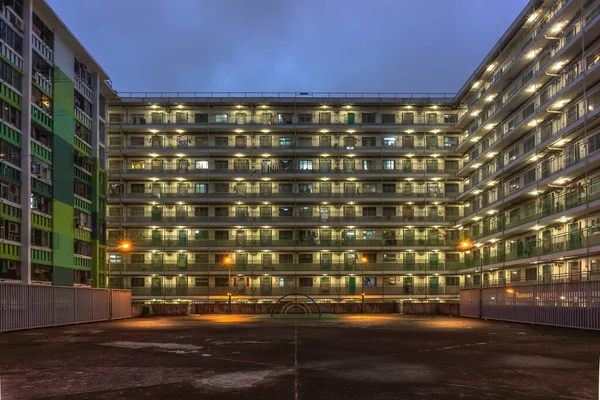 Night view of Aged Public Rental Housing Estate in Shek Kip Mei in Hong Kong with climbing frame at playground