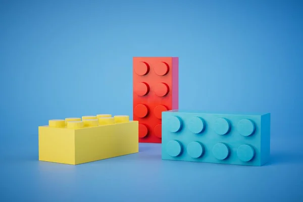 multi-colored Lego blocks on a blue background. 3D render.