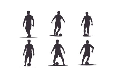 Futbolcu silueti. Siluet takımının siluet oyuncusu topa vuruyor.