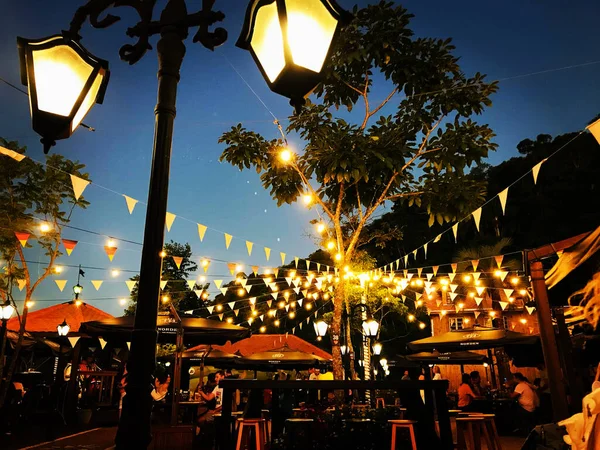 String of lights and light fixtures in evidence at dusk in a Pub in Blumenau, Santa Catarina, Brazil, at the time of Octoberfest.