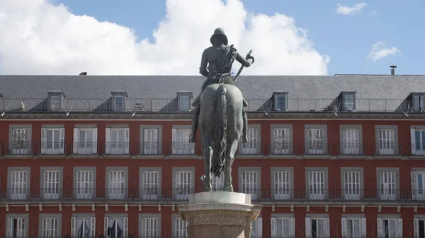 Sculpture with horse on its back in the main square of Madrid (Spain)