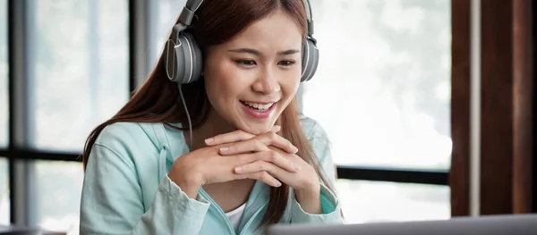 Female Student Wearing Headphone Touching Chin Hands While Sitting Library — Stock Photo, Image