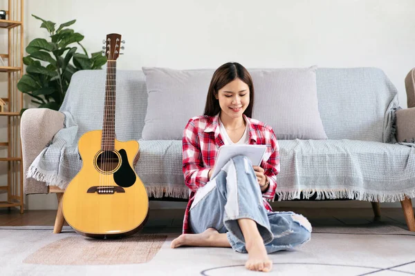 Young Woman Compose Song Writing Lyrics Notebook Playing Guitar While — Stock Photo, Image