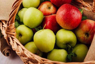 Close up of red and green apples with water drops