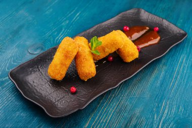 Breaded chicken strips with tomato ketchup