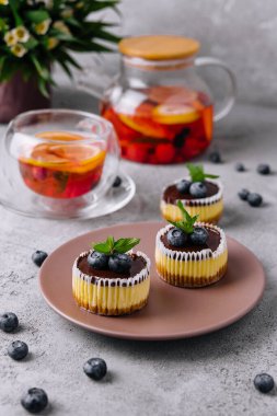 Mini chocolate cheesecake decorated with blueberries