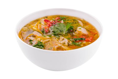chicken noodle soup in a white ceramic bowl isolated on white