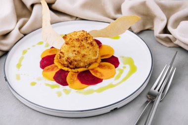 breaded cutlet with sweet potato and beets