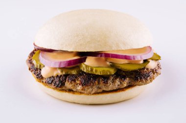Burger with pork cutlet on white background