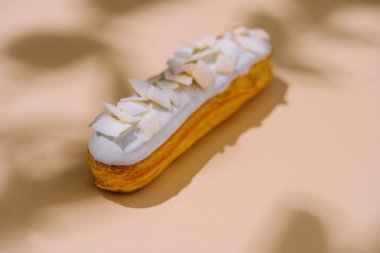 Eclairs with vanilla glaze close up