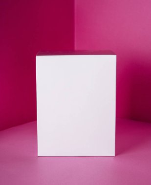 White gift box on pink background