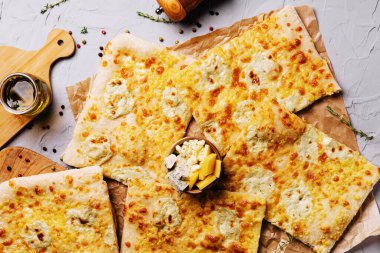 Delicious Italian cheese pizza on cutting board