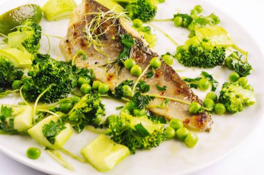 Baked sea fish fillet with vegetables