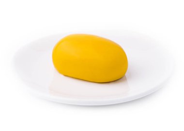 Yellow French mousse-cake on plate