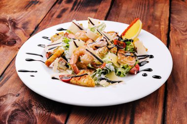 Italian Caesar salad with shrimp, croutons and parmesan