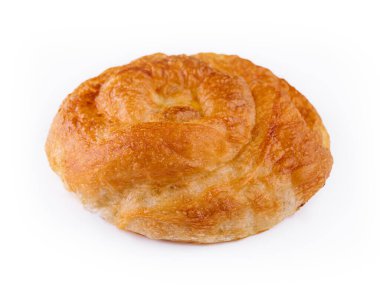 Puff pastry bun rolled up in the form of a snail