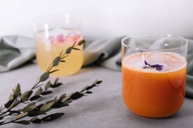 carrot juices and pineapple in glass with cubes Ice