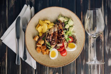 Buddha bowl salad with grilled chicken breast slices