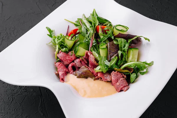 Meat Carpaccio with Rocket Salad on plate