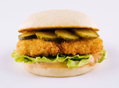 burger with nuggets and pickled cucumbers