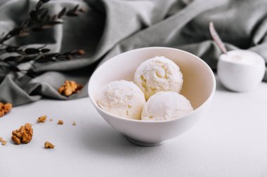 Vanilla ice cream balls with walnut