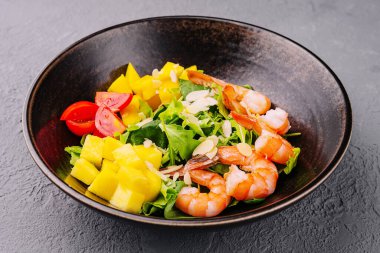Seafood salad in ceramic bowl top view