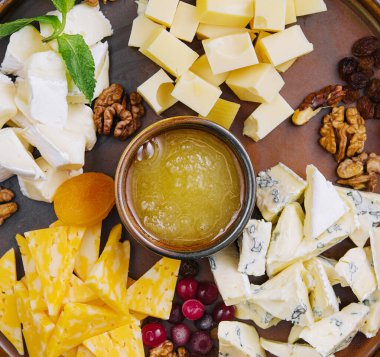Different types of delicious cheese and snacks