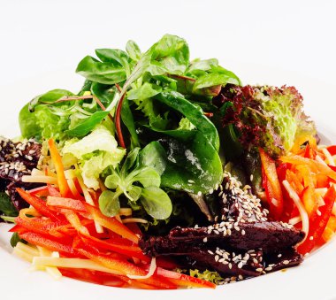 Slice fresh vegetables on the white plate